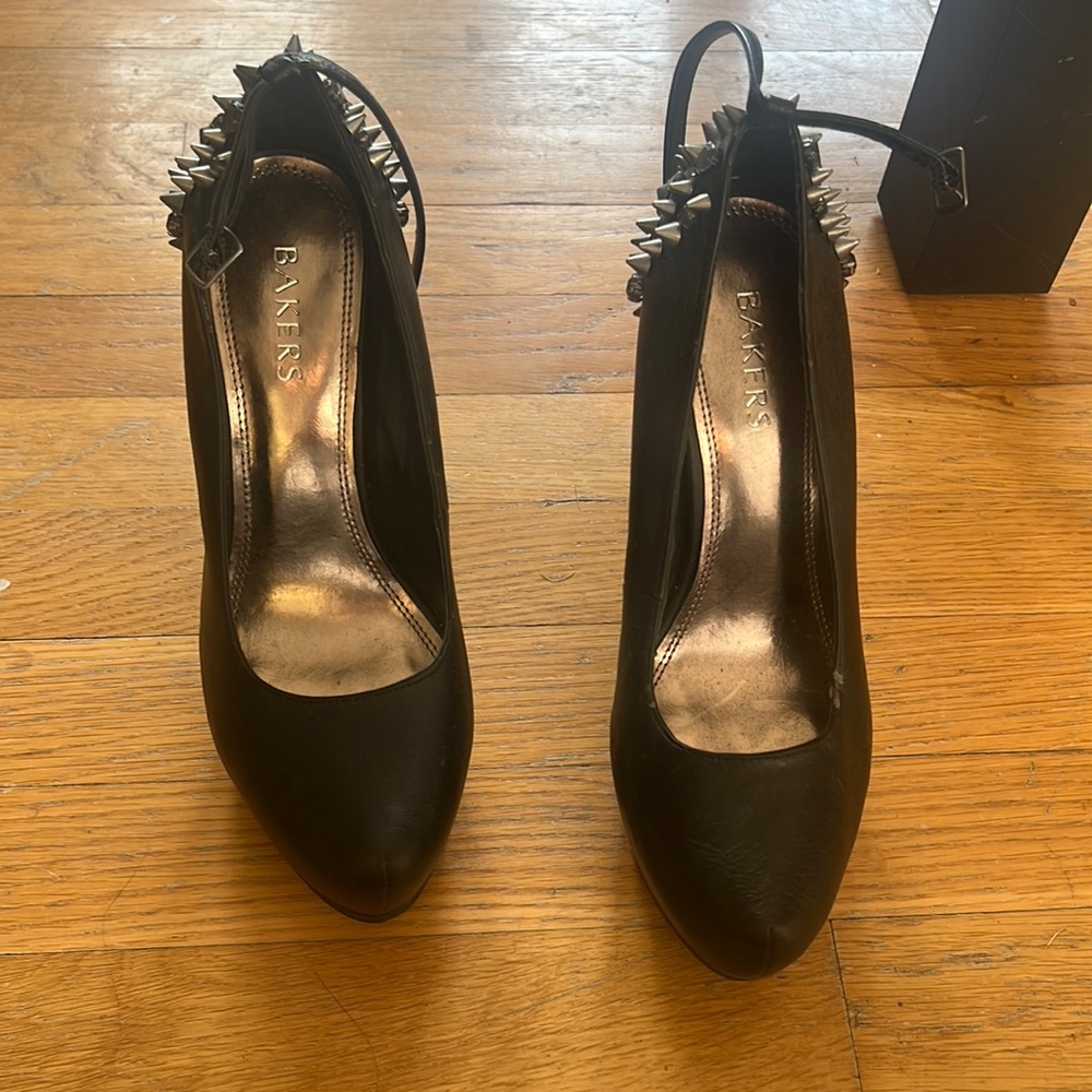 Size 8.5 heels with spikes and gems on the back.
